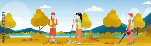 street cleaners team working together sweeping lawn raking leaves cleaning service teamwork concept city park autumn landscape background full length flat horizontal