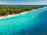 Tropical beach with white sand and turquoise ocean. Aerial view. Paradise holiday resort