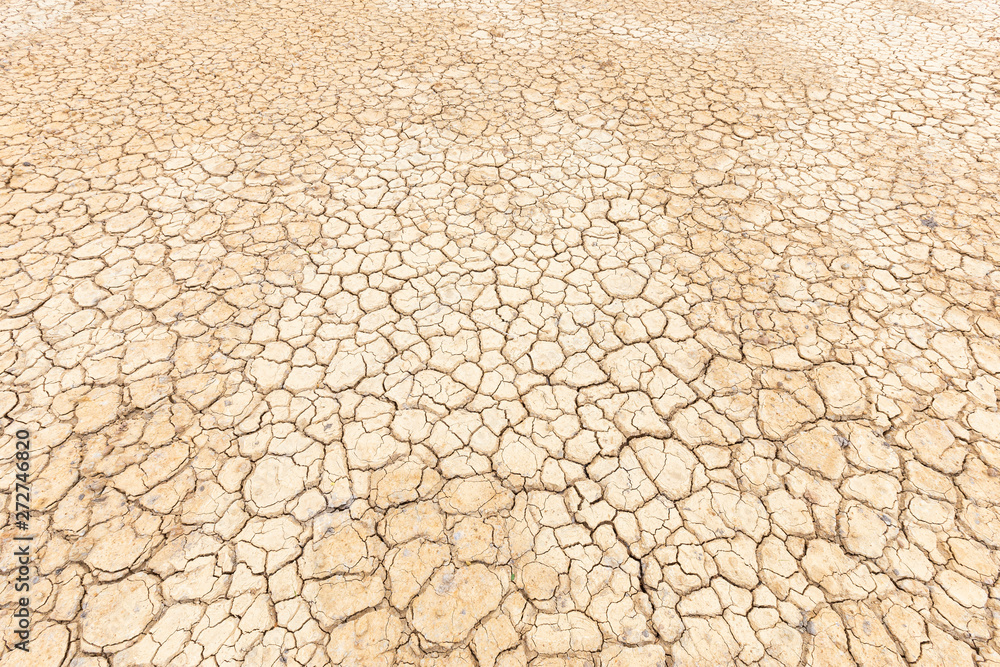 Brown dry soil or cracked ground texture background. Brown dry soil or cracked ground texture background.