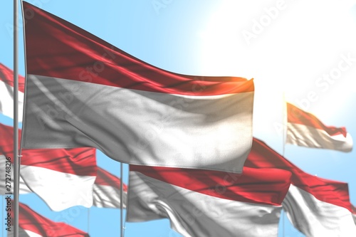 wonderful any feast flag 3d illustration. - many Indonesia flags are wave against blue sky picture with bokeh
