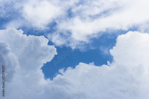 blue sky background with tiny clouds