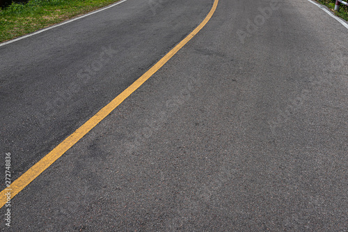 Asphalt road with marking lines white stripes texture Background.