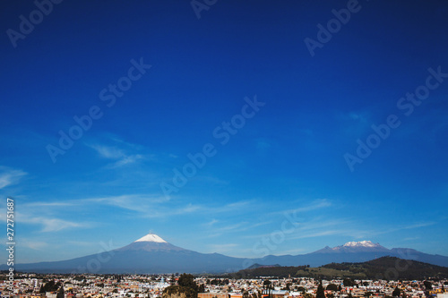 Popocatepetl Volcano and view of Cholula town in Puebla Mexico photo