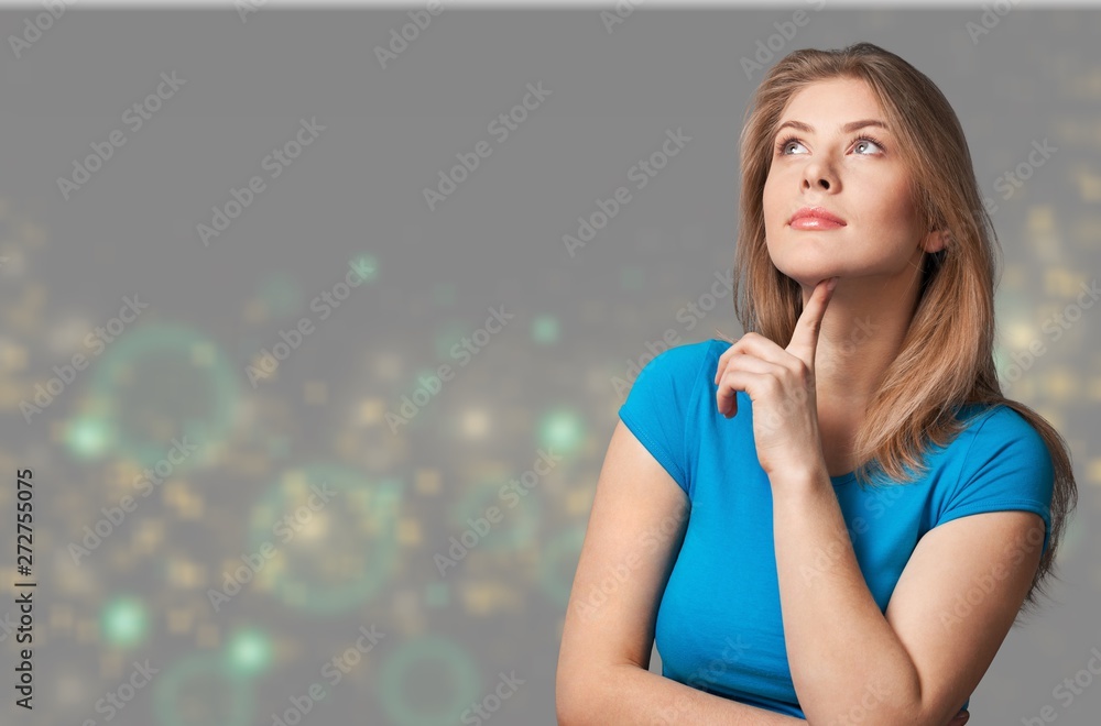 Pretty young thoughtful woman on background Pretty young thoughtful woman on background