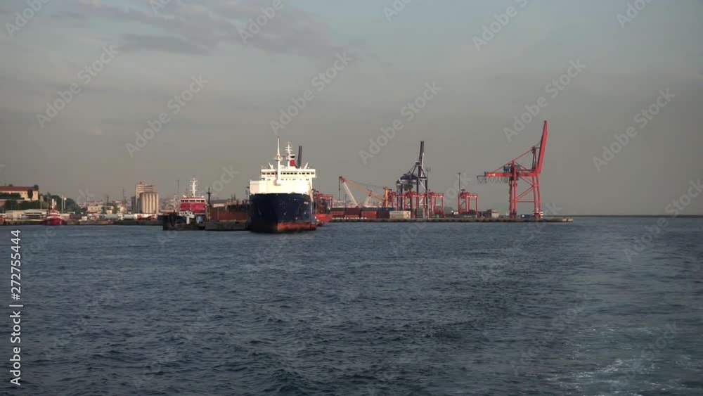 There's a big white ship in the industrial port. Cloudy sky, high cargo cranes There's a big white ship in the industrial port. Cloudy sky, high cargo cranes