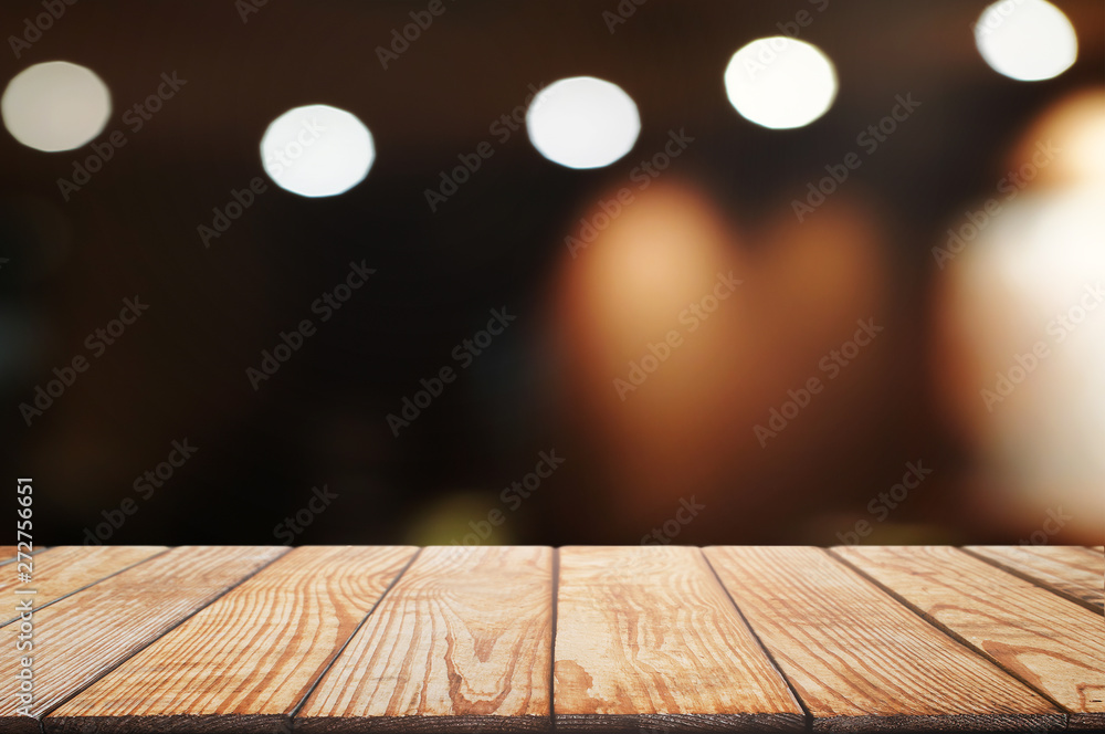 empty wood table top over blur in restaurant cafe background. empty wood table top over blur in restaurant cafe background.