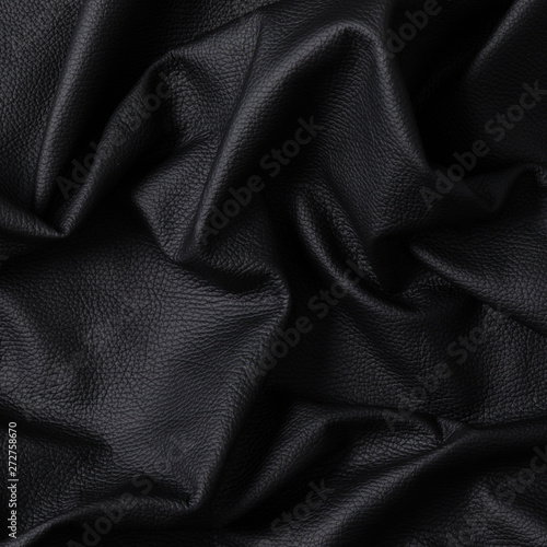 Closeup of dark color leather material texture background