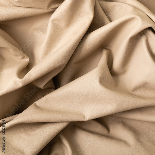 Closeup of light color leather material texture background