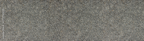 Natural stone wall wide texture. Pebble dash rough surface panorama. Pebbledash panoramic background photo