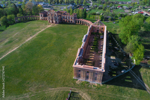 Above the ruins of the ancient palace of the princes Sapeg on a sunny April day (aerial photography). Ruzhany, Belarus photo