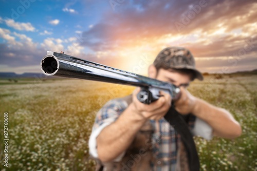 Male Hunter with Rifle on natural background