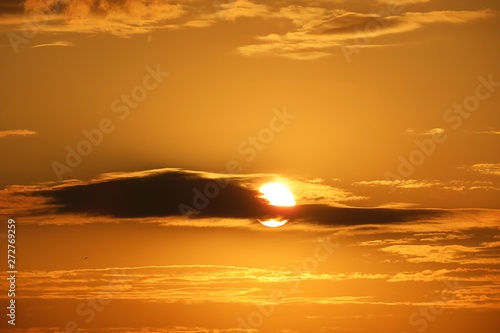 Beautiful golden yellow sunset background in the sky