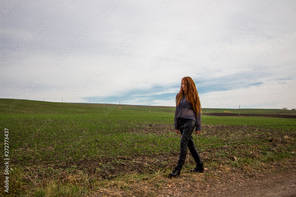young beautiful woman in the field