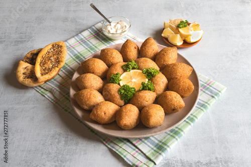 Traditional Arabic kibbeh with lamb and pine nuts. photo