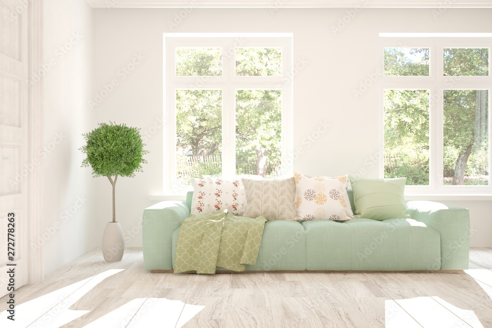 Fototapeta premium Stylish room in white color with sofa and summer landscape in window. Scandinavian interior design. 3D illustration