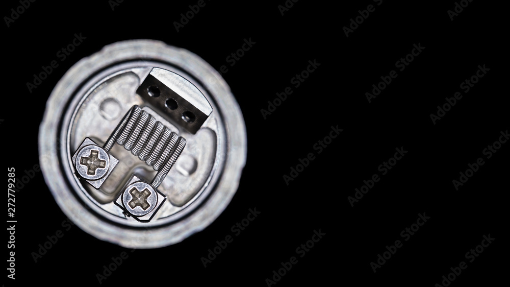 close up, macro shot, top view of single fused clapton coil in rebuildable tank atomizer for flavour chaser isolated on black background, vaping device, selective focus close up, macro shot, top view of single fused clapton coil in rebuildable tank atomizer for flavour chaser isolated on black background, vaping device, selective focus