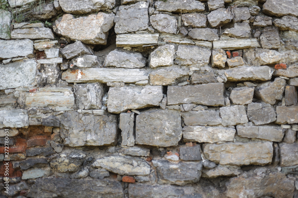 Fototapeta premium Texture of a stone wall. Old stone wall texture background.