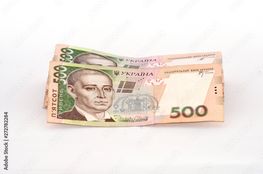 Money Ukrainian hryvnia on a white background, a large bundle of bills Money Ukrainian hryvnia on a white background, a large bundle of bills