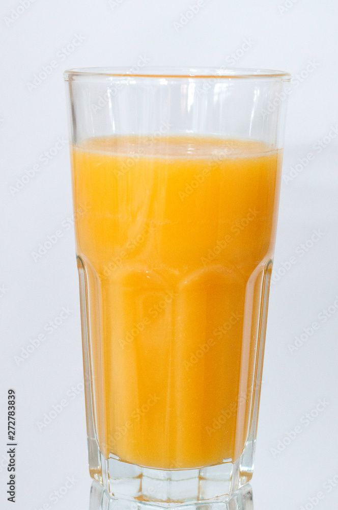 Orange juice glass, isolated on white background, vertical format Orange juice glass, isolated on white background, vertical format
