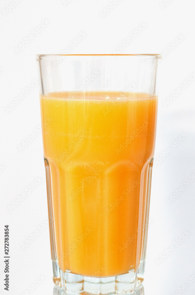 Orange juice glass, isolated on white background, vertical format Orange juice glass, isolated on white background, vertical format