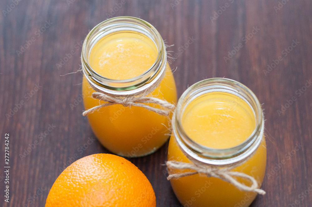 Orange juice in cans rustic style top view, flat lay Orange juice in cans rustic style top view, flat lay