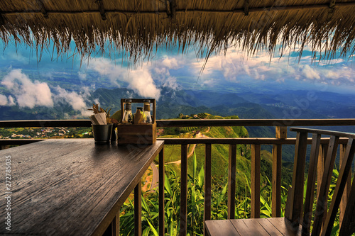 The wood table set in the restaurant,good emotion and beautiful cliff view.