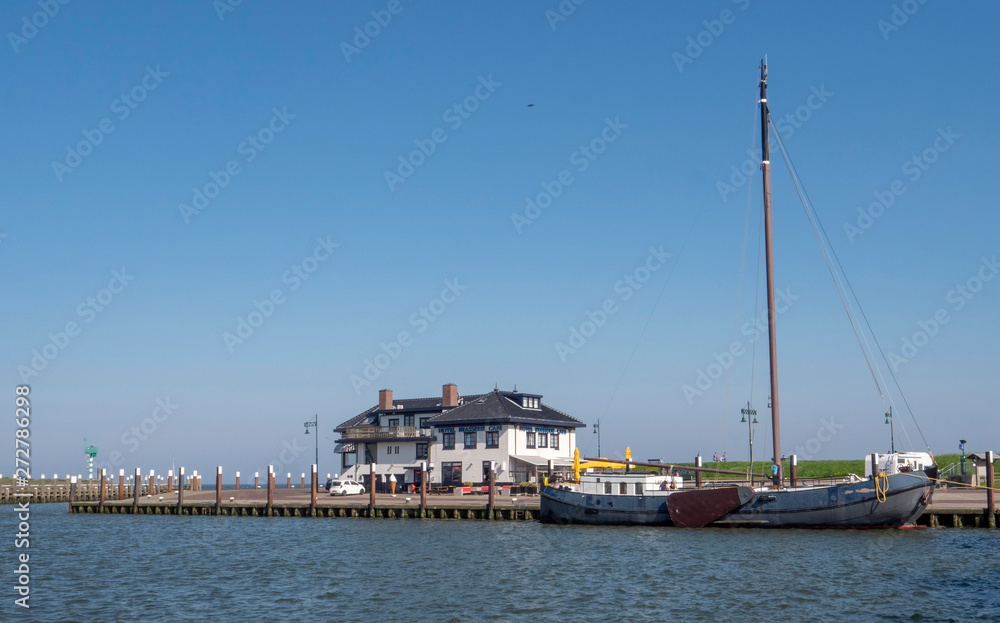 Harbour Oudeschild Texel Netherlands. Tjalk. Boat and restaurant.