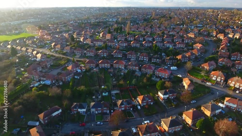 Aerial drone footage over a British council housing estate, UK houses and homes