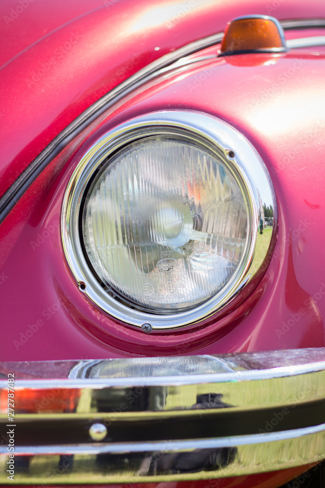 Headlight on a red car