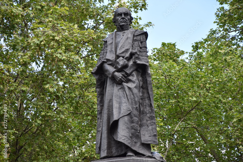Details on Statue of Gladstone at Aldwych, London, nearby to the Royal Courts of Justice and opposite Australia House. William Ewart Gladstone (1809 - 1898) was a British Liberal politician. - Details on Statue of Gladstone at Aldwych, London, nearby to the Royal Courts of Justice and opposite Australia House. William Ewart Gladstone (1809 - 1898) was a British Liberal politician. -