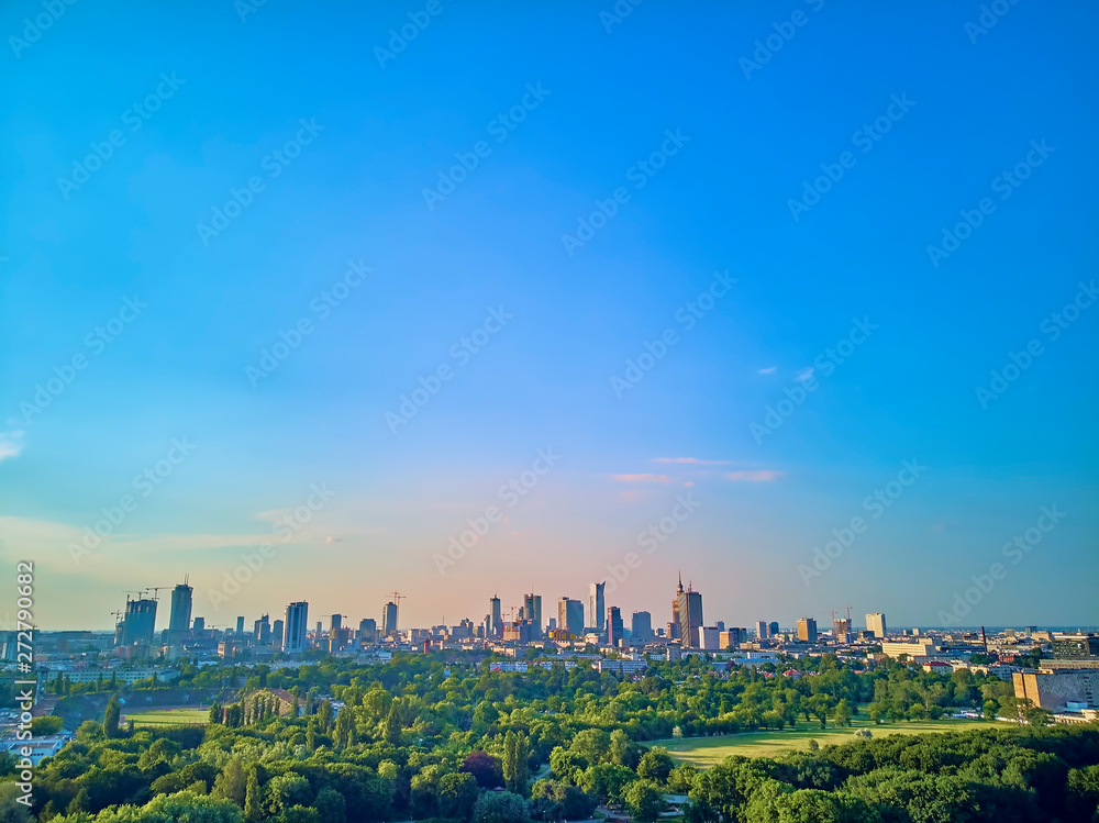 A beautiful panoramic view of the sunset in a fabulous evening in June from drone at Pola Mokotowskie in Warsaw, Poland - 