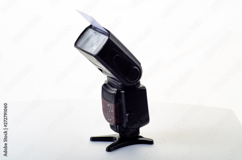 The camera flash is isolated on a white background The camera flash is isolated on a white background