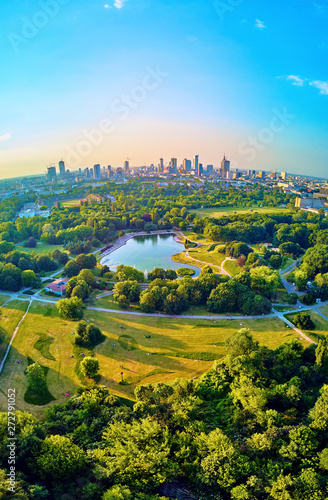 A beautiful panoramic view of the sunset in a fabulous evening in June from drone at Pola Mokotowskie in Warsaw, Poland - "Mokotow Field" is a large park in Warsaw - Is called "Jozef Pilsudski Park"