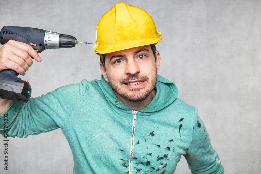 the construction worker holds an electric screwdriver in his hand, various situations the construction worker holds an electric screwdriver in his hand, various situations