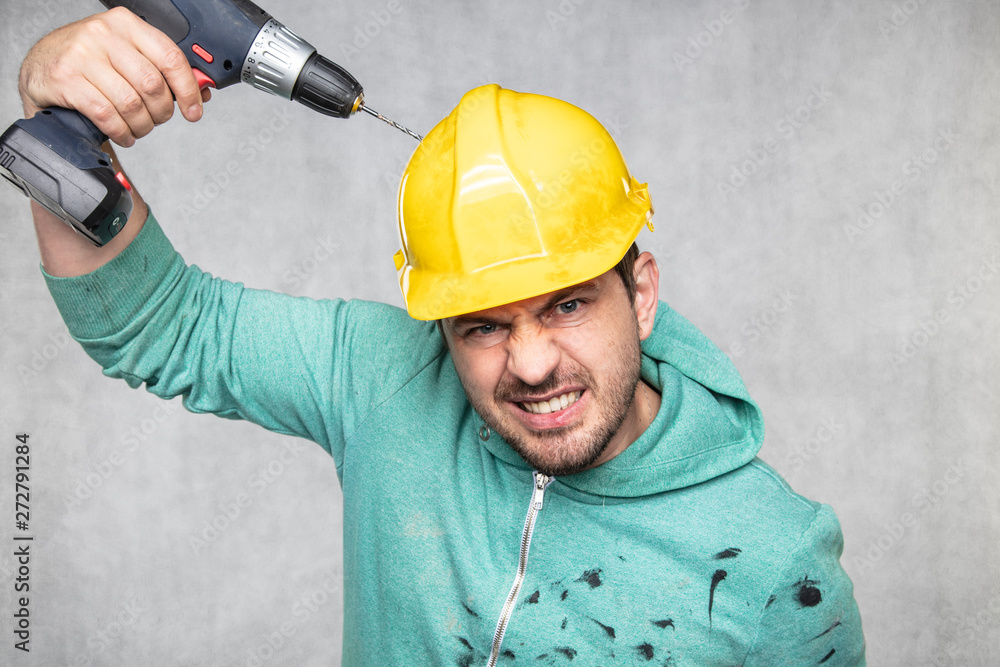 the construction worker holds an electric screwdriver in his hand, various situations the construction worker holds an electric screwdriver in his hand, various situations