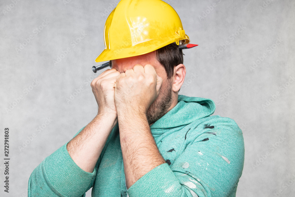 construction worker with a nail in his head, accident during work construction worker with a nail in his head, accident during work