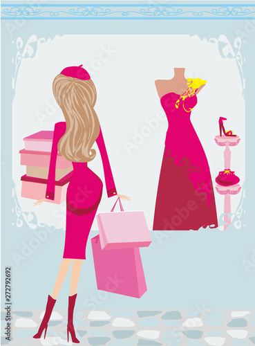 Stylish girl on fashion shopping in an elegant boutique © diavolessa