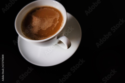 cup of coffee on black background