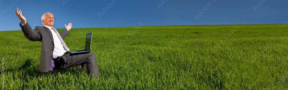 Businessman With Laptop Computer in Green Field Banner Panorama Businessman With Laptop Computer in Green Field Banner Panorama