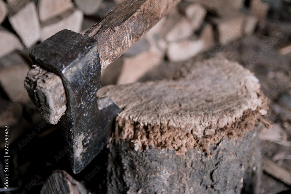 Ax protruding from a log Ax protruding from a log