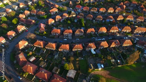 Aerial drone footage over a British council housing estate, UK houses and homes