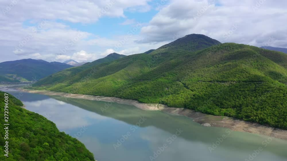 Lake among the mountains covered with forest. Aerial view Lake among the mountains covered with forest. Aerial view