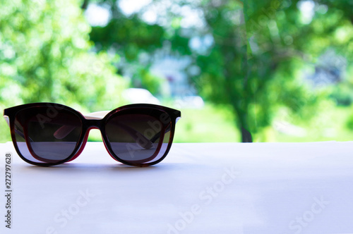 lifestyle,sun glasses,sunglasses,vacation,accessory,fashion,ocean,summer,glasses,blue,sun,travel,sunshine,relax,concept,sky,holiday,sunny,background,day,tropical,beach,view,grand,water