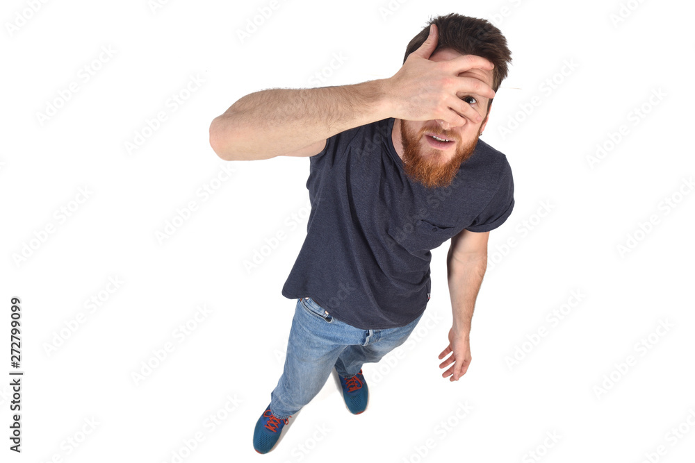 man peeking with hand on face on white background man peeking with hand on face on white background