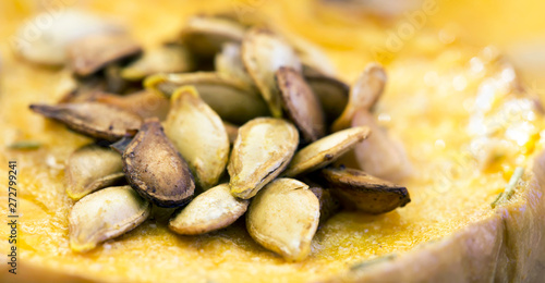 Close-up of roasted yellow pumpkin seeds, healthy eating, vegetarian snack food banner © Reddogs