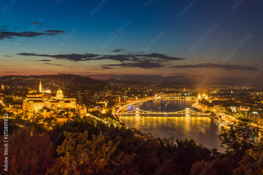 Aerial beautiful illuminatetd urbanscape with the Danube river of Budapest, the main city of Hungary in Europe by night.