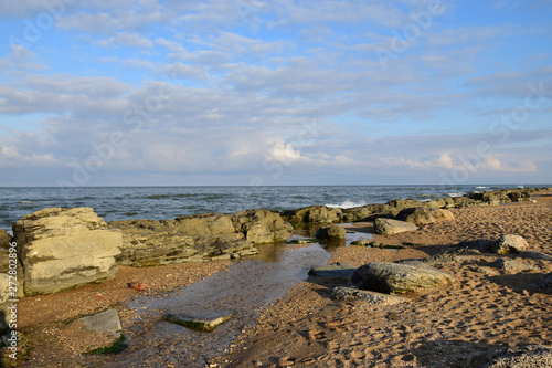 Panorama sandy coast of Caspian Sea with waves