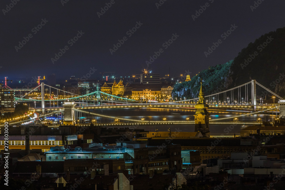 Illuminated bridges of Budapest at night.