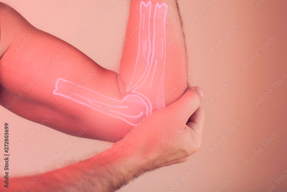 Man feels pain in elbow. People, healthcare and medicine concept Man feels pain in elbow. People, healthcare and medicine concept