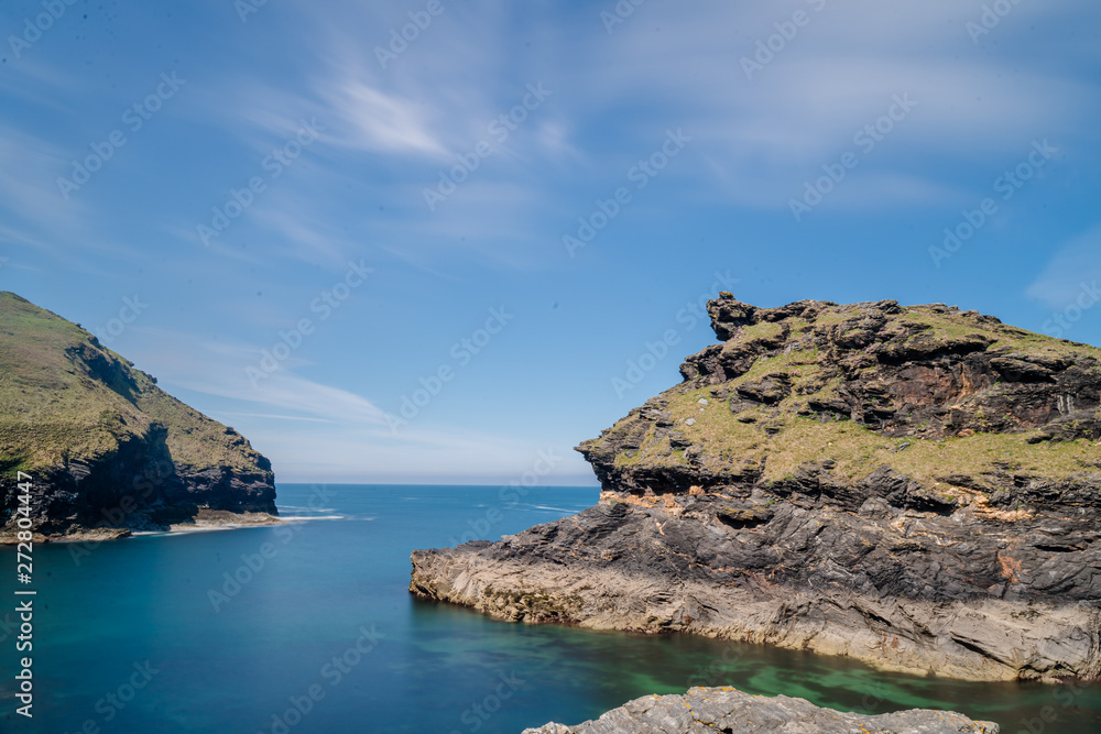 rocky landscape in wales overlooking the sea with blue sky